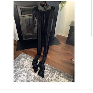 Black velvet jumpsuit with tags still on